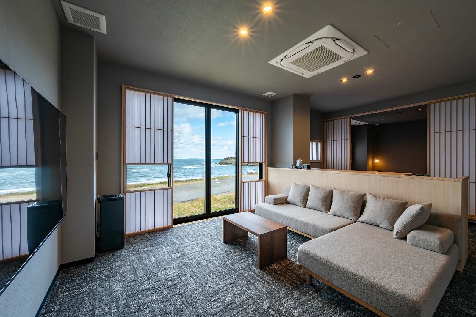 Living area of Kaze no Ma, with the sea of Hashitate beyond shoji-screened windows